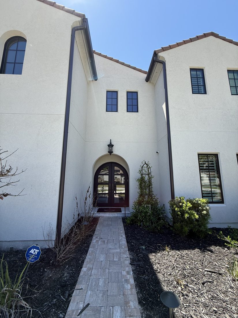 Arched front entry and foyer windows
